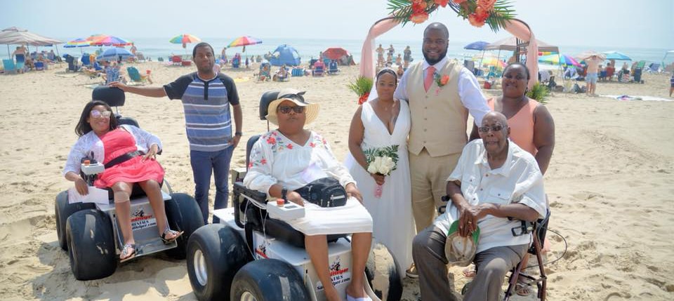 Family rents two beach wheelchairs to attend a wedding